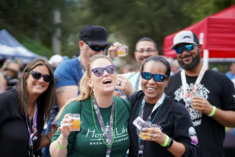Group of festival attendees laughing together