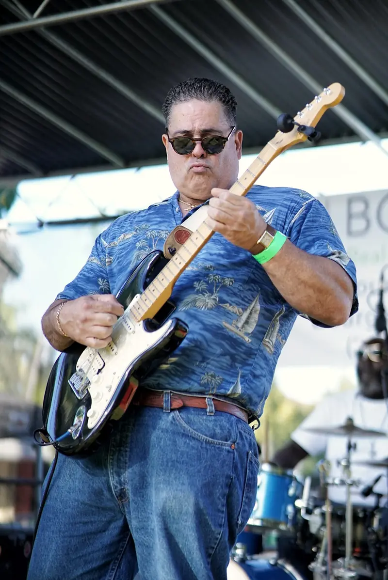 Guitarist performing live music at Treasure Coast Brew Fest